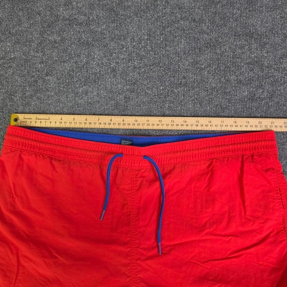Polo Ralph Lauren orange swim shorts with blue drawstrings. Size XL.